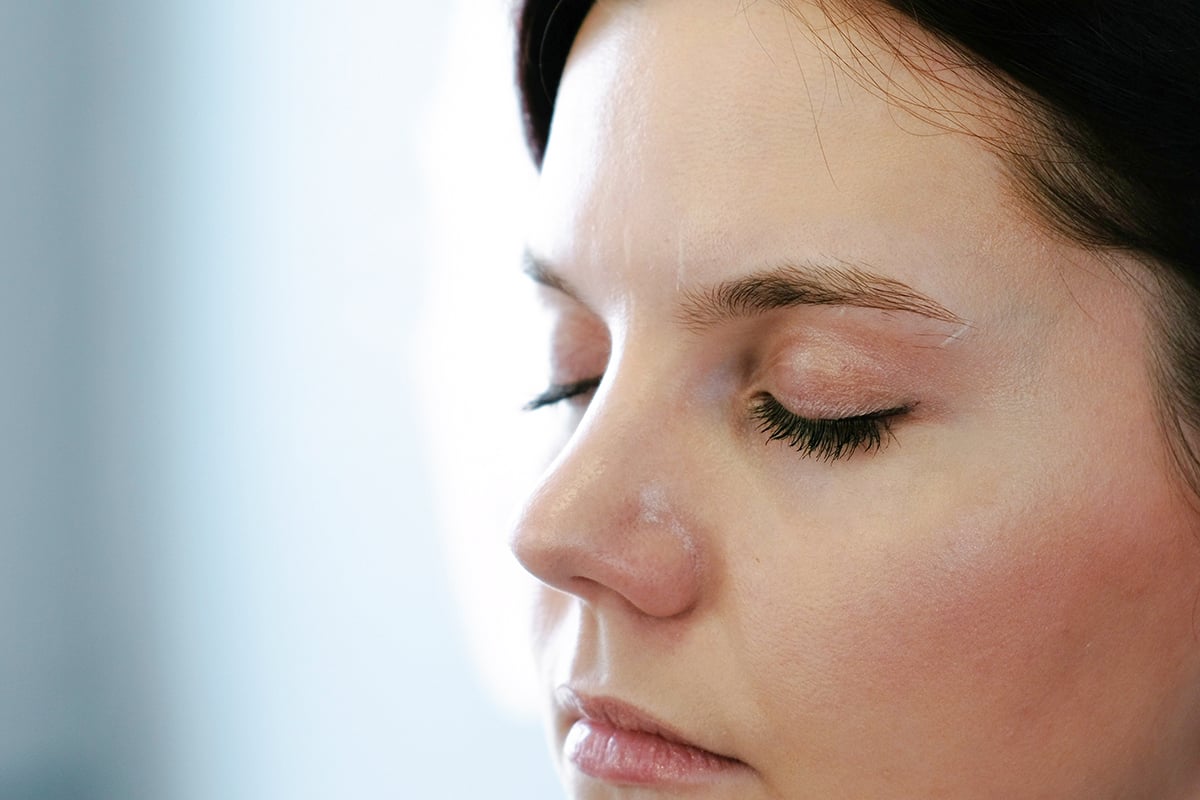 close up face of woman brunette looking down close up face of woman brunette looking down