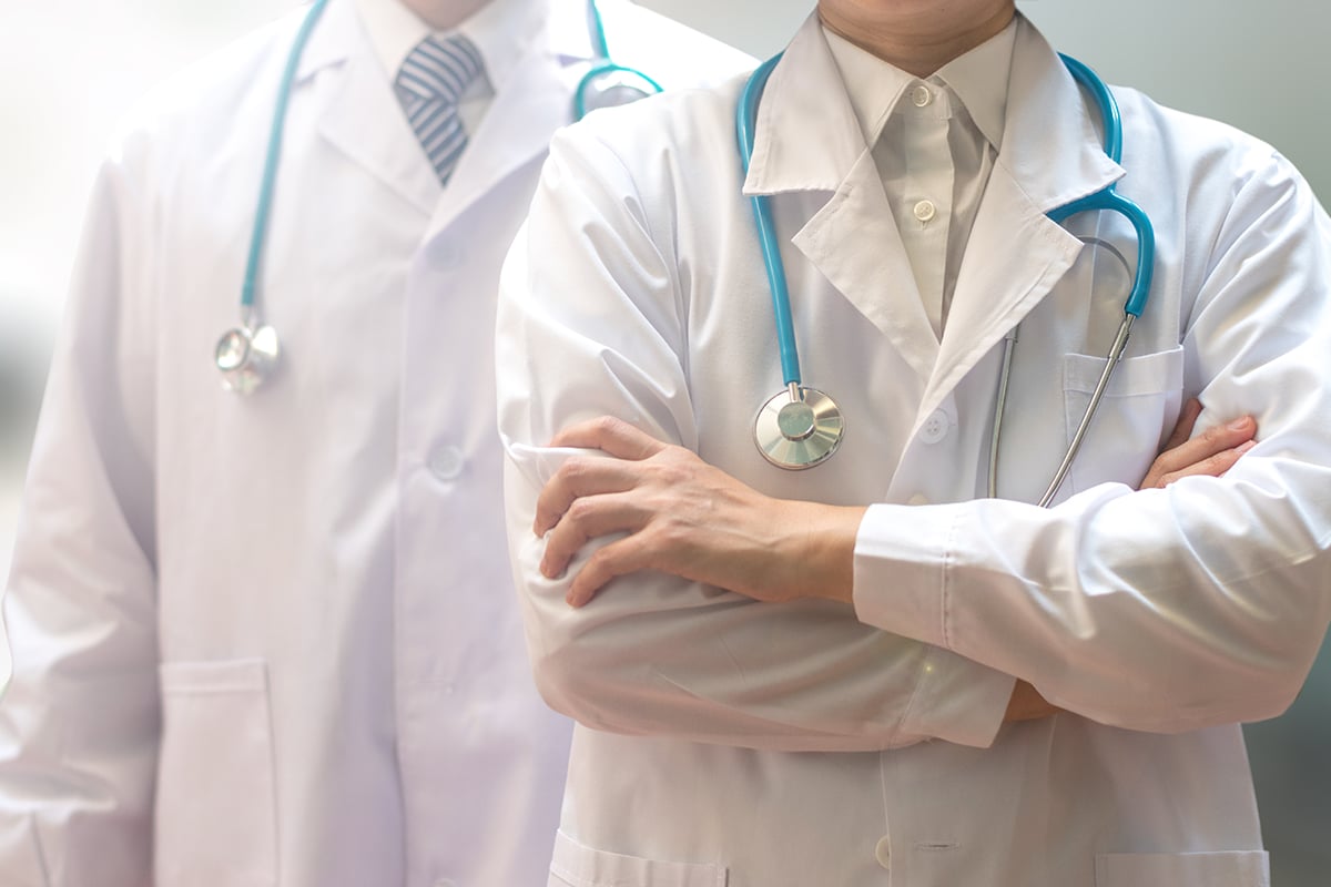 medical doctor or physician team in white gown uniform with stethoscope in hospital medical doctor or physician team in white gown uniform with stethoscope in hospital